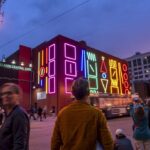 Under the Cover of Darkness: Spidertag’s Interactive Neon Mural lights